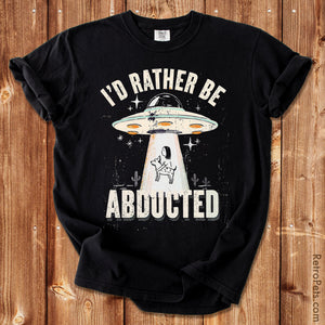 Retro UFO graphic illustration abducting a dog with I'd Rather Be Abducted lettering on a Comfort Colors t-shirt