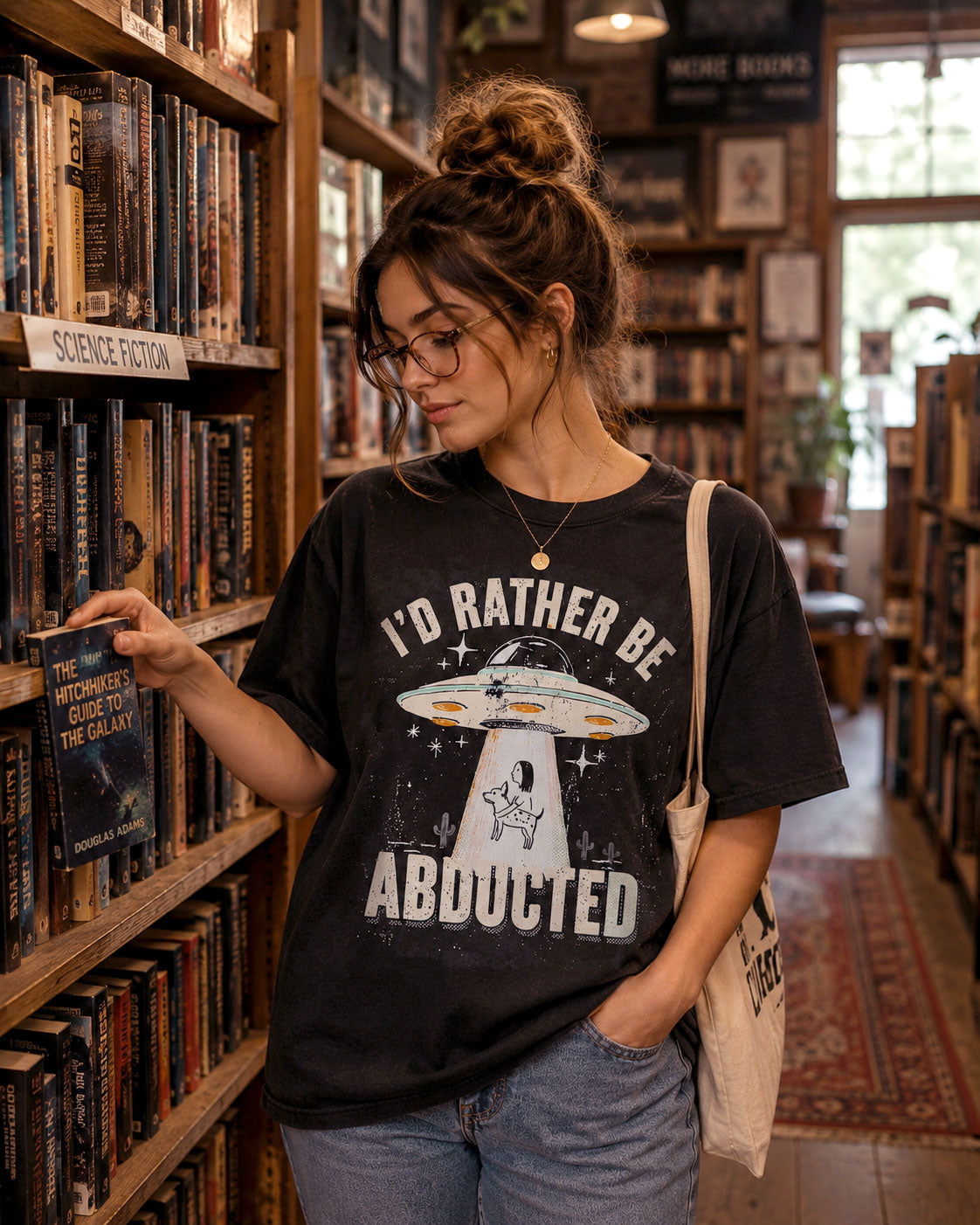 Retro UFO graphic illustration abducting a dog with I'd Rather Be Abducted lettering on a Comfort Colors t-shirt