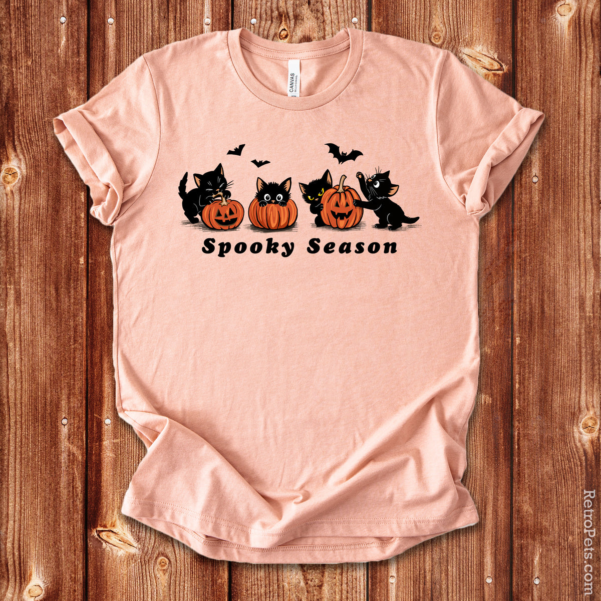 Spooky Season Halloween cat t-shirt in Heather Peach on wood background
