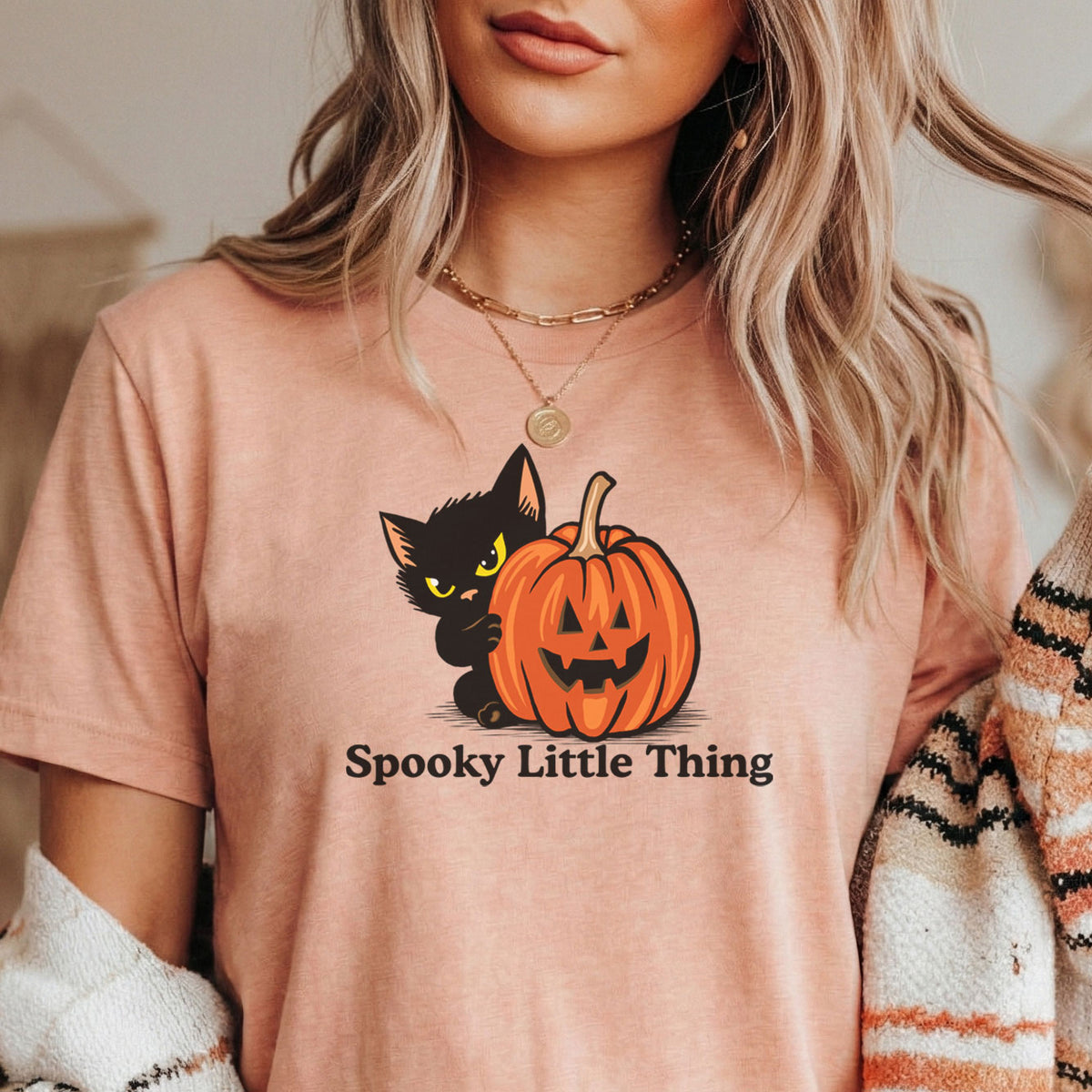 Person wearing the Spooky Little Thing Halloween cat t-shirt, alternate color