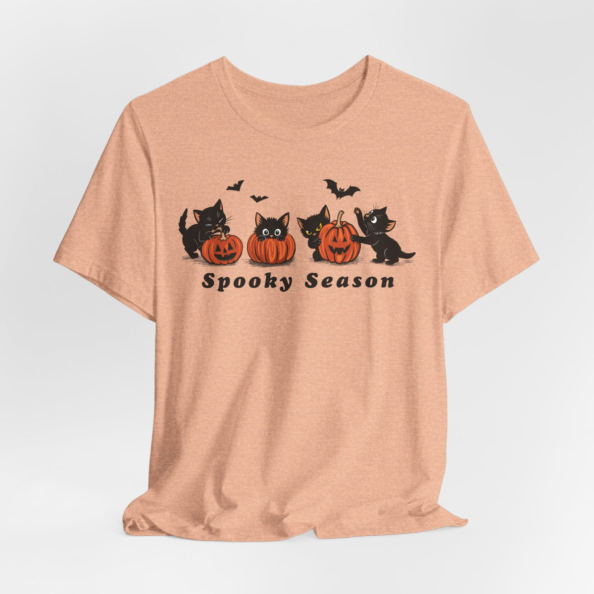 Spooky Season Halloween cat t-shirt in Heather Peach, flat lay